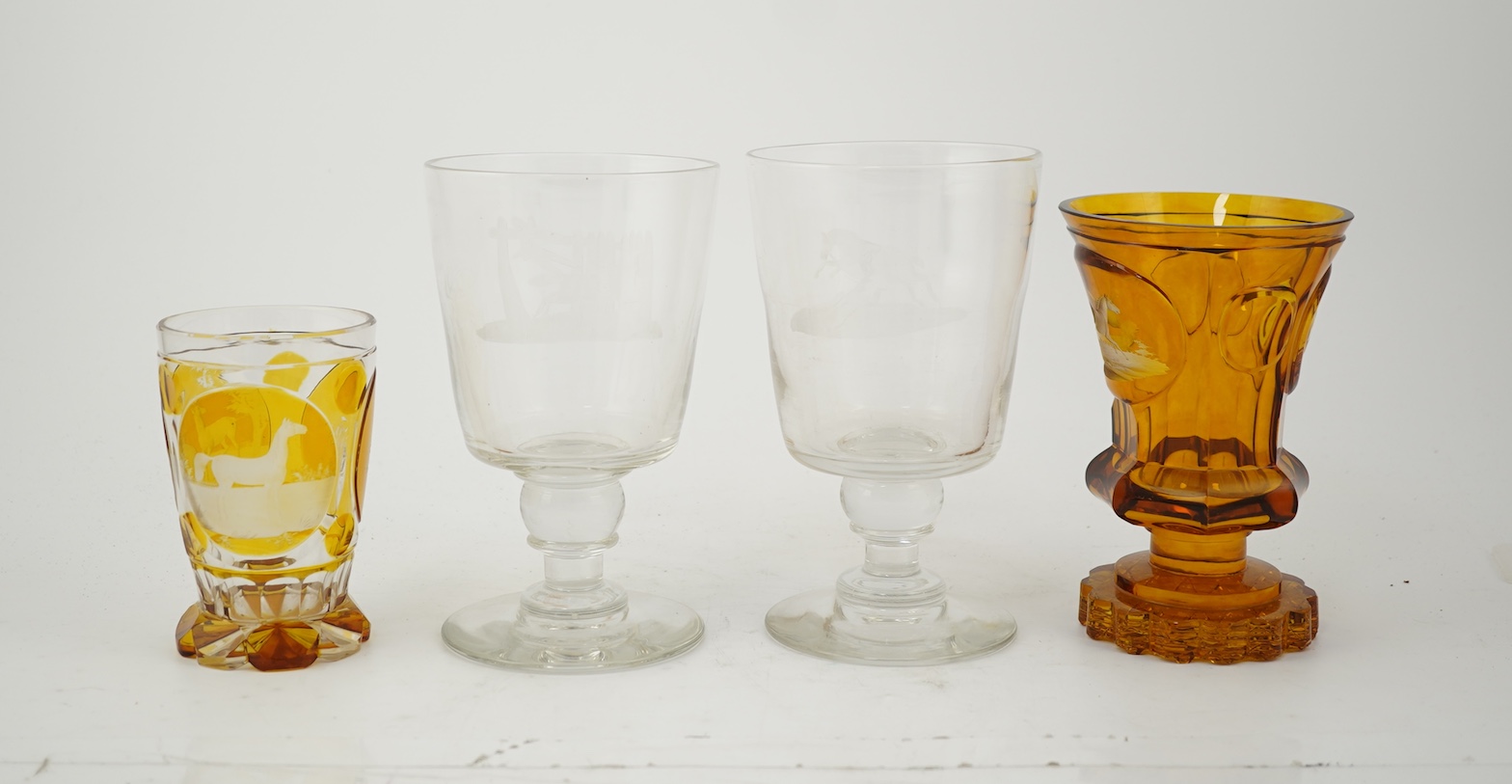 Horse interest - two German amber flashed beakers and two engraved rummers, 19th century
